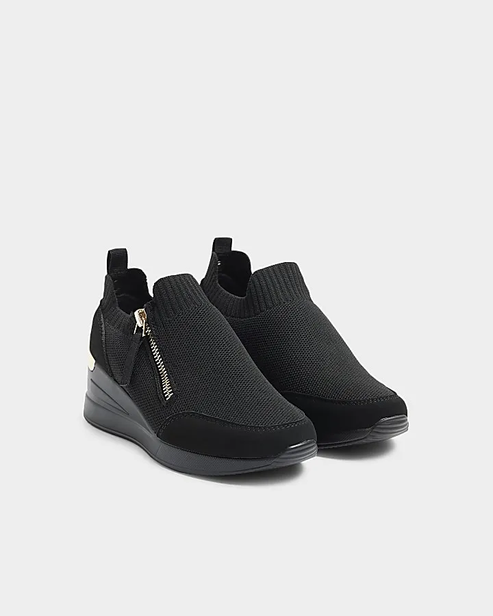 Girls black knit wedge trainers