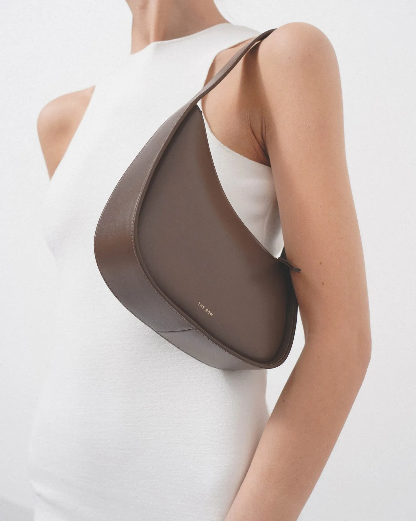 The Row Half Moon brown leather shoulder bag